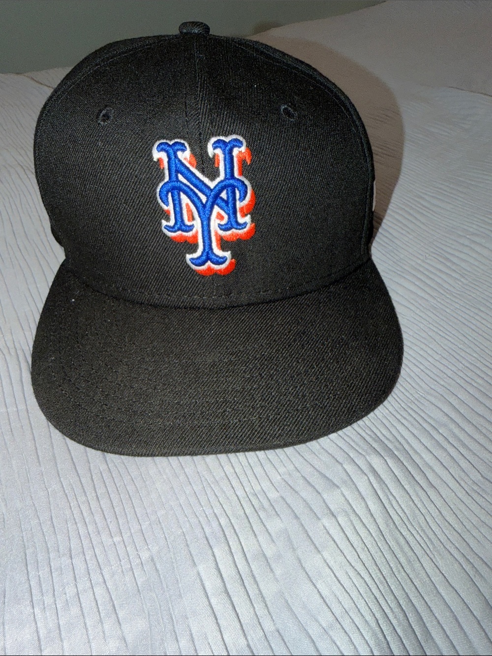 New Era Black Hat with Blue and Orange Logo